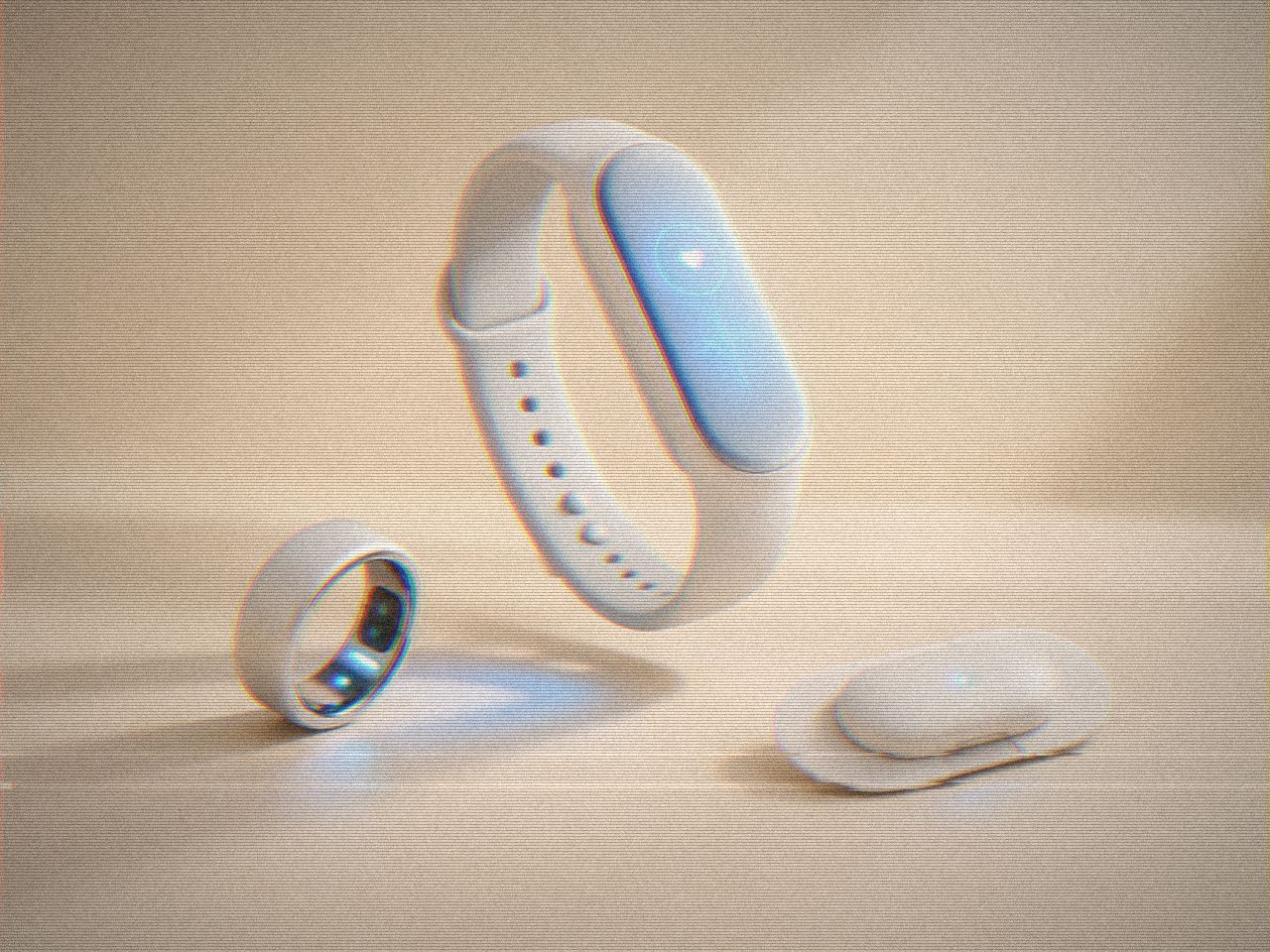 Wearable wellness devices on a warm backdrop